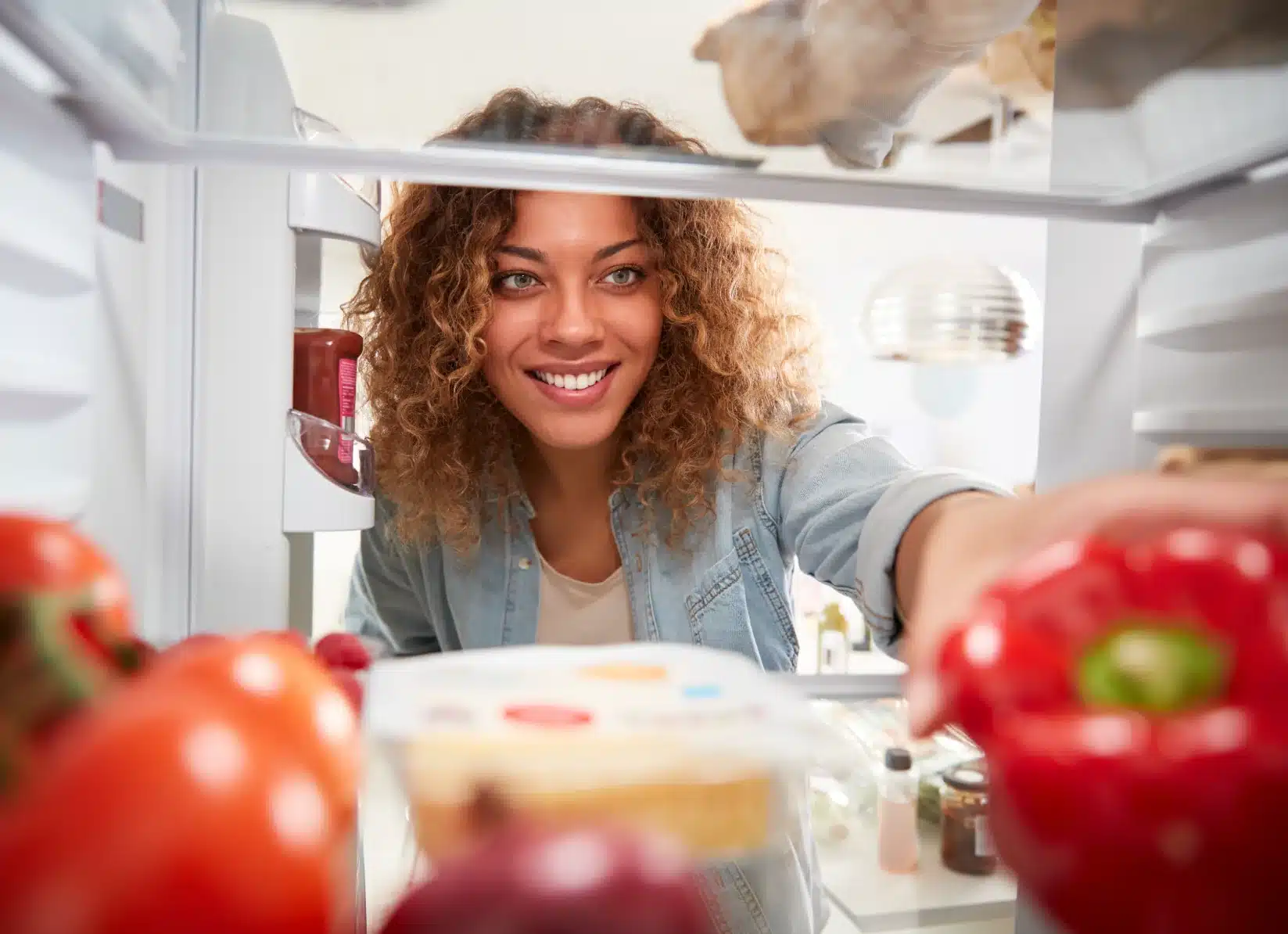 Woman-reaching-in-refrigerator.png